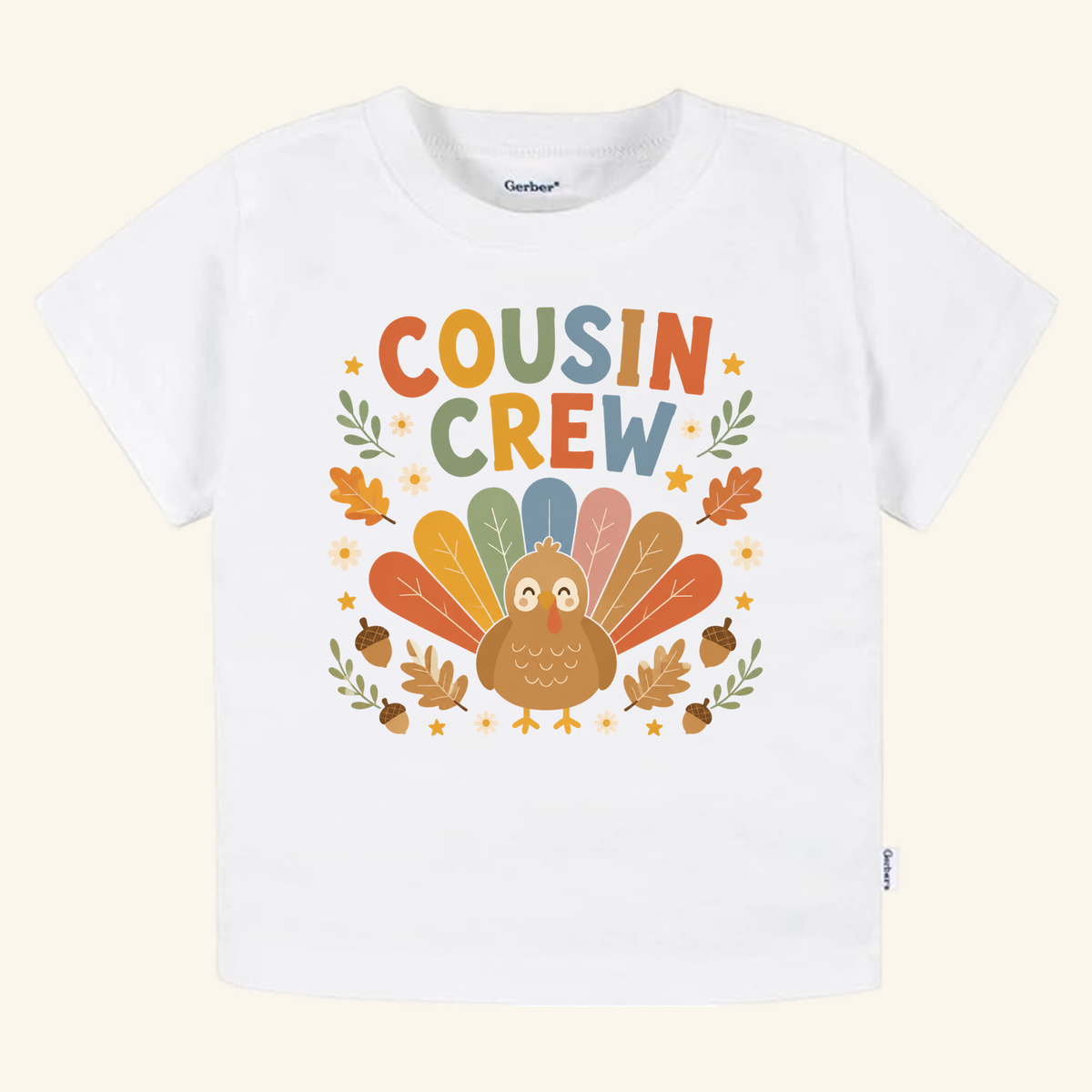 White Thanksgiving Cousin Shirt – Cousin Crew Turkey Toddler Tee featuring a cartoon turkey with colorful feathers and the text COUSIN CREW surrounded by autumn leaves, acorns, and small flowers.