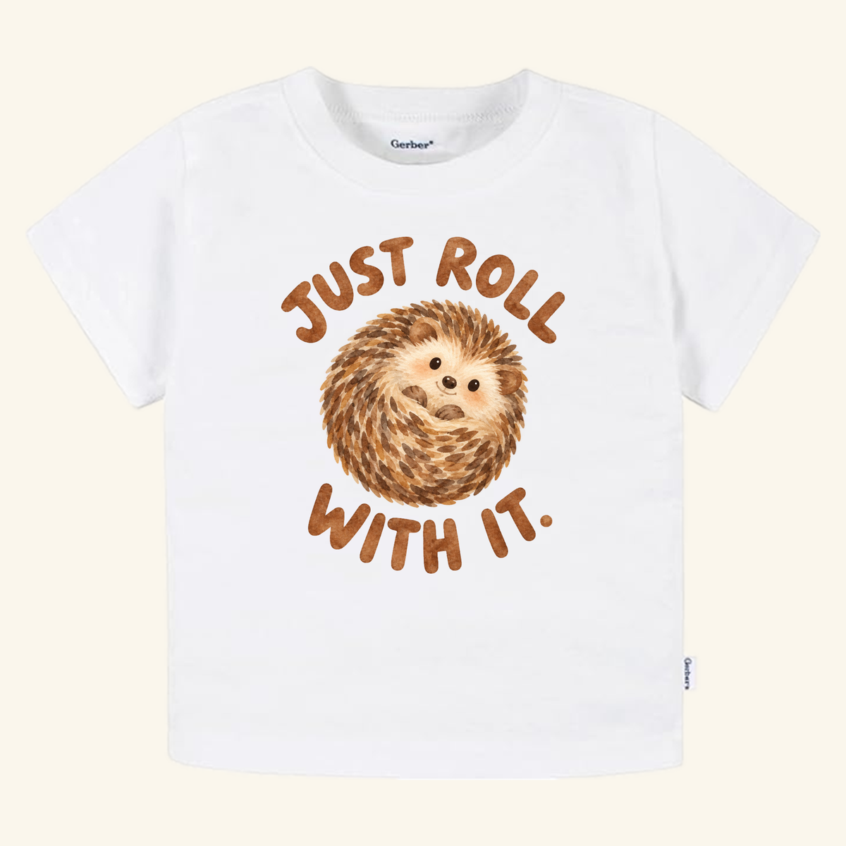White Just Roll With It Toddler Shirt – Cute Hedgehog Tee featuring an illustration of a curled-up hedgehog and the text JUST ROLL WITH IT.