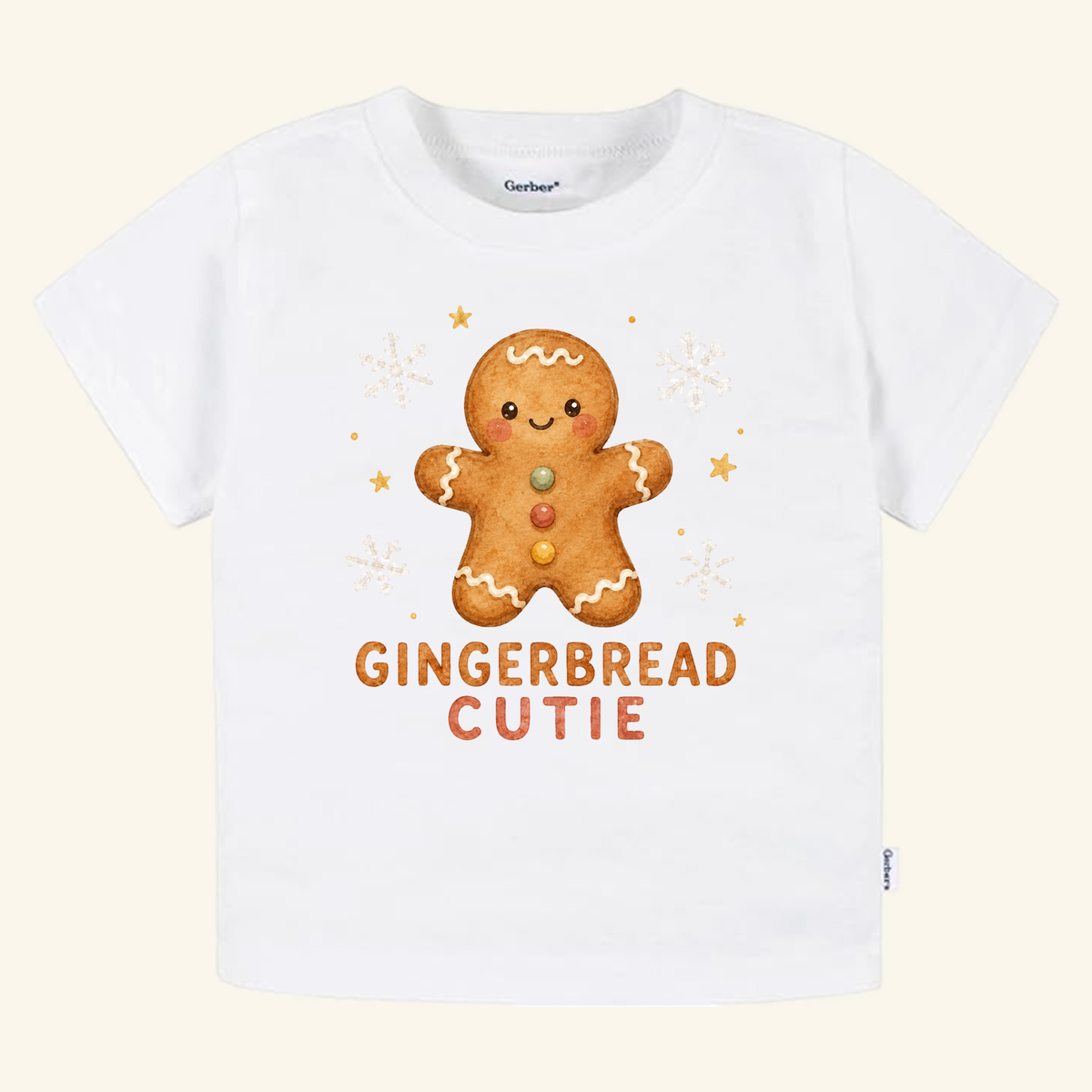 White toddler Gingerbread Cutie Toddler Shirt – Cute Christmas Gingerbread Man Tee featuring a gingerbread man graphic surrounded by snowflakes and stars, with the text GINGERBREAD CUTIE printed below.
