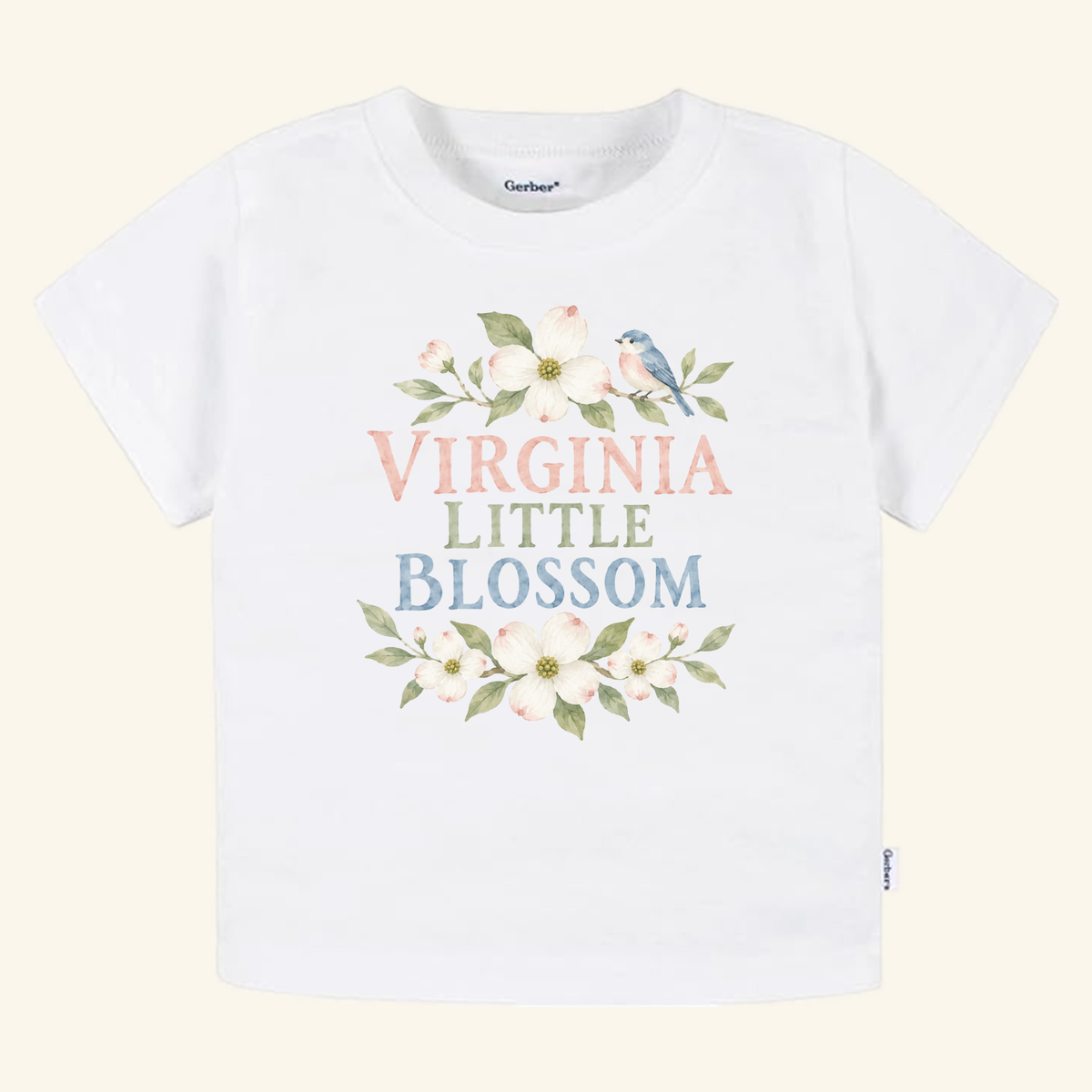 White Virginia Toddler Shirt – Little Blossom Dogwood Floral Tee featuring dogwood flowers, a small blue bird, and the text VIRGINIA LITTLE BLOSSOM in pastel colors.