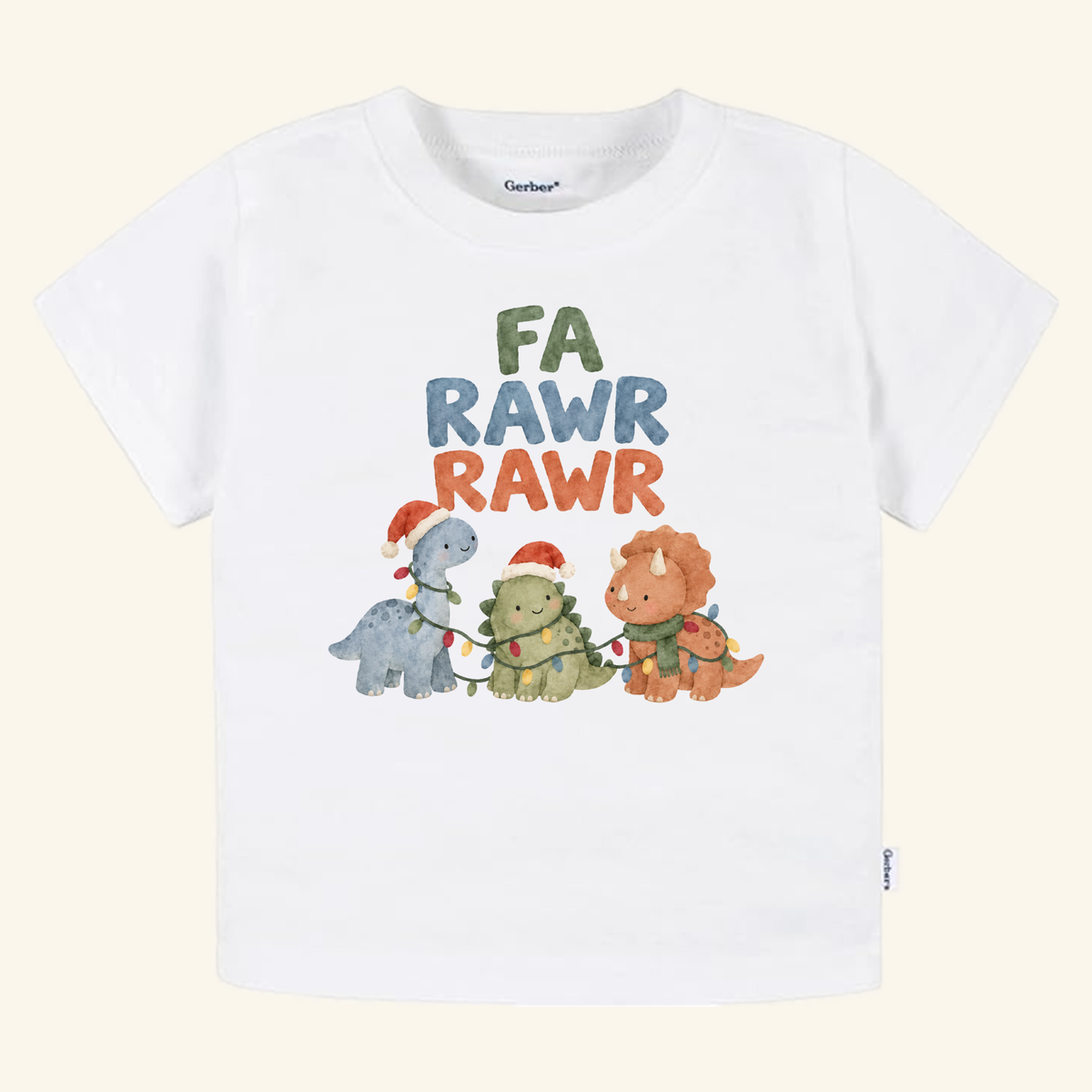 A white Fa Rawr Rawr Toddler Shirt featuring three dinosaurs wearing hats and scarves tangled in string lights, with the text FA RAWR RAWR above them.