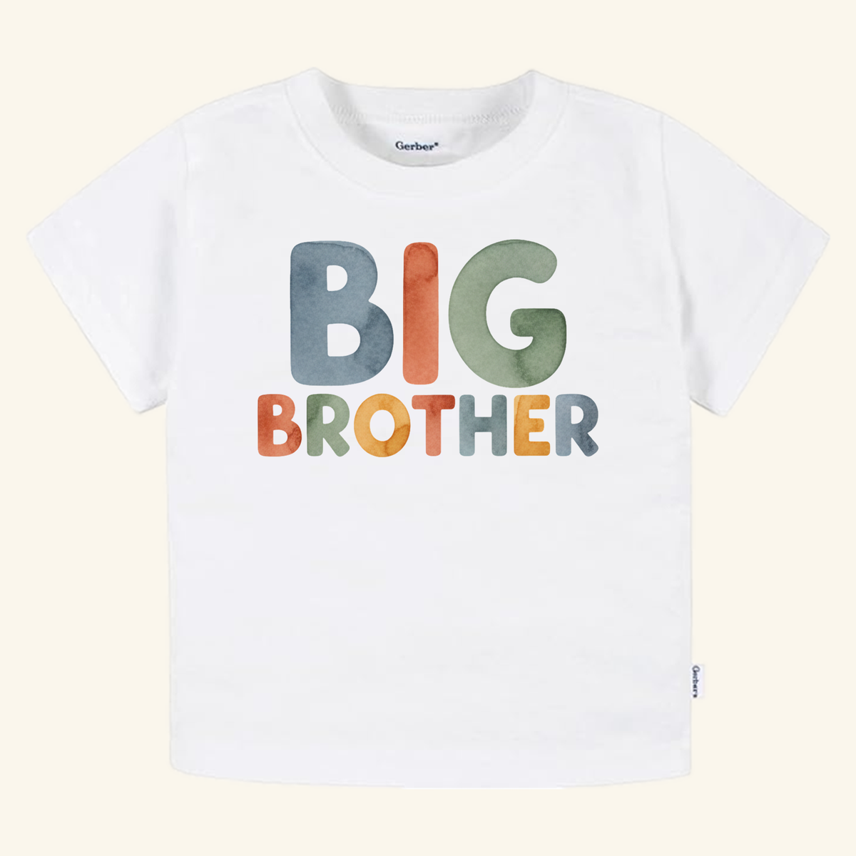Toodleroos Big Brother Watercolor Toddler Shirt in white featuring the text printed in multicolored, watercolor-style block letters.