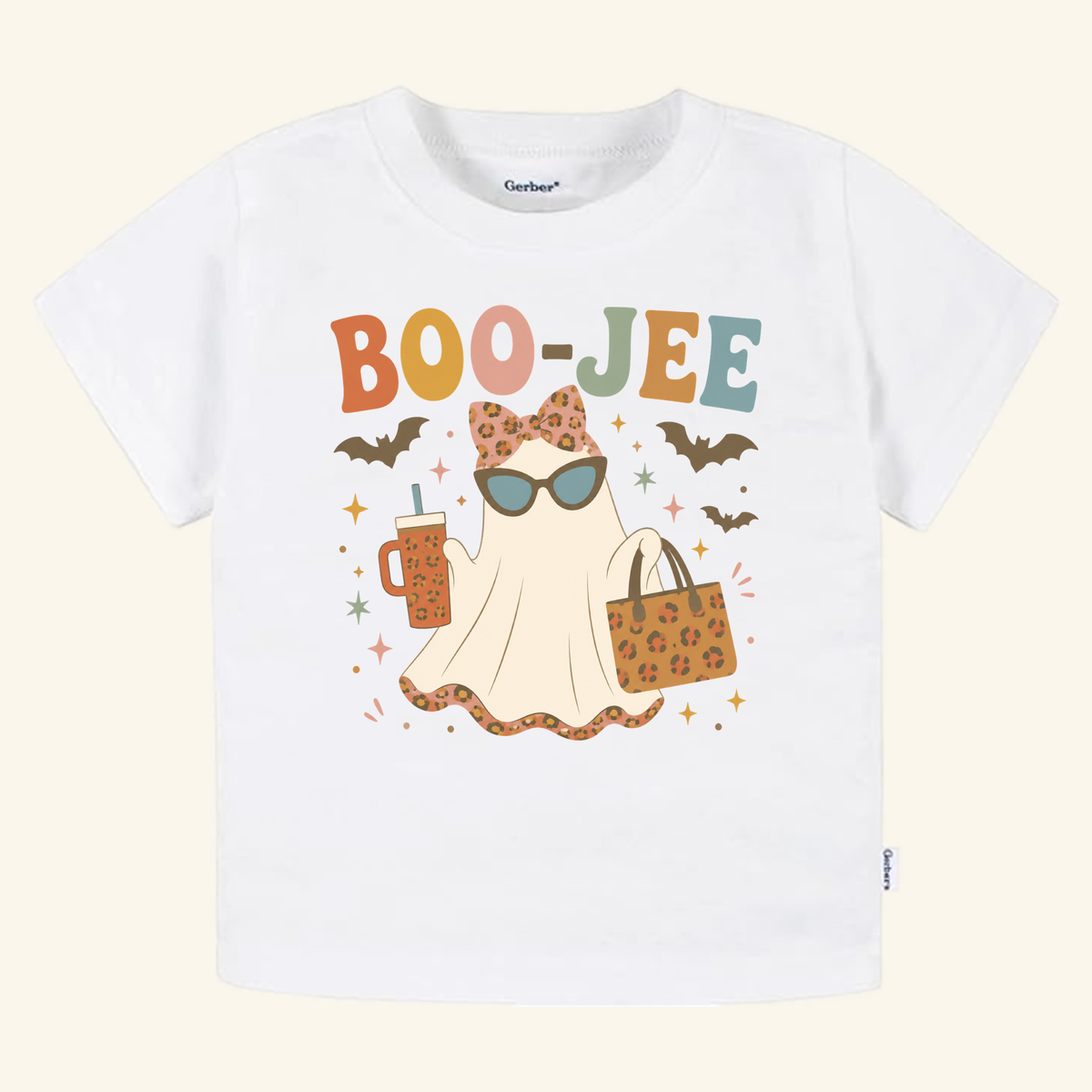 Toddler Girl Halloween Shirt – Boo-Jee Ghost Short-Sleeve Tee featuring a white shirt with a ghost wearing sunglasses and a bow, holding a drink and a patterned bag, with the text BOO-JEE above it.