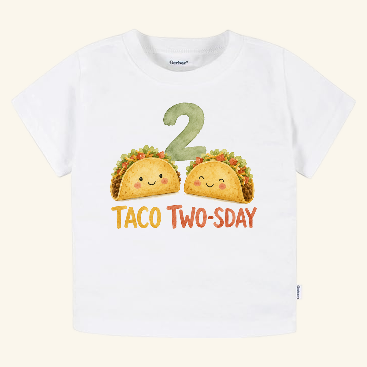 White short-sleeve Taco Two-sday 2nd Birthday Toddler Shirt featuring a large green number 2, two smiling cartoon tacos, and the text TACO TWO-SDAY.