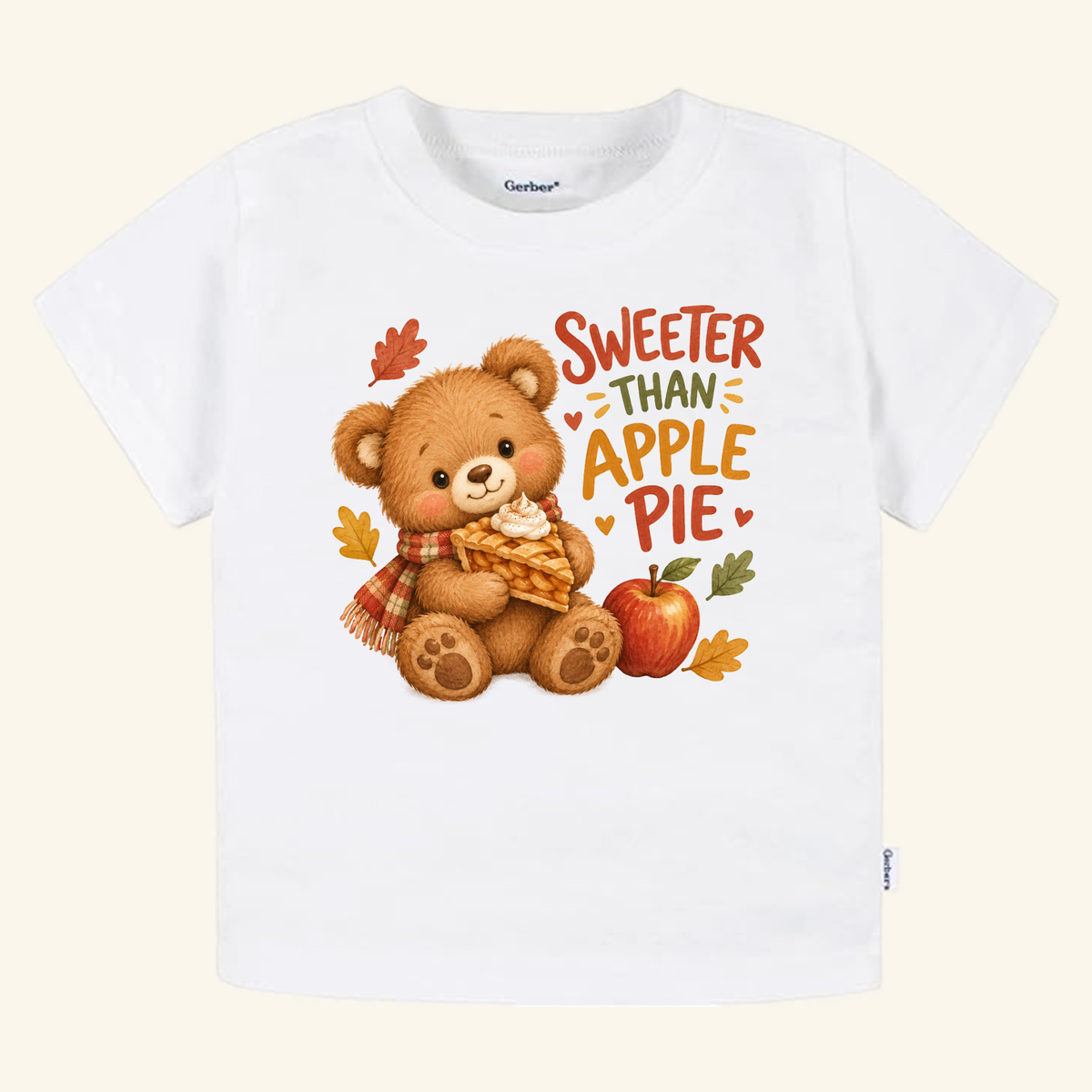 Sweeter Than Apple Pie Toddler Shirt – Fall Bear Short-Sleeve Tee featuring a white toddler shirt with a bear wearing a scarf and holding a slice of apple pie, with text that reads Sweeter than apple pie.