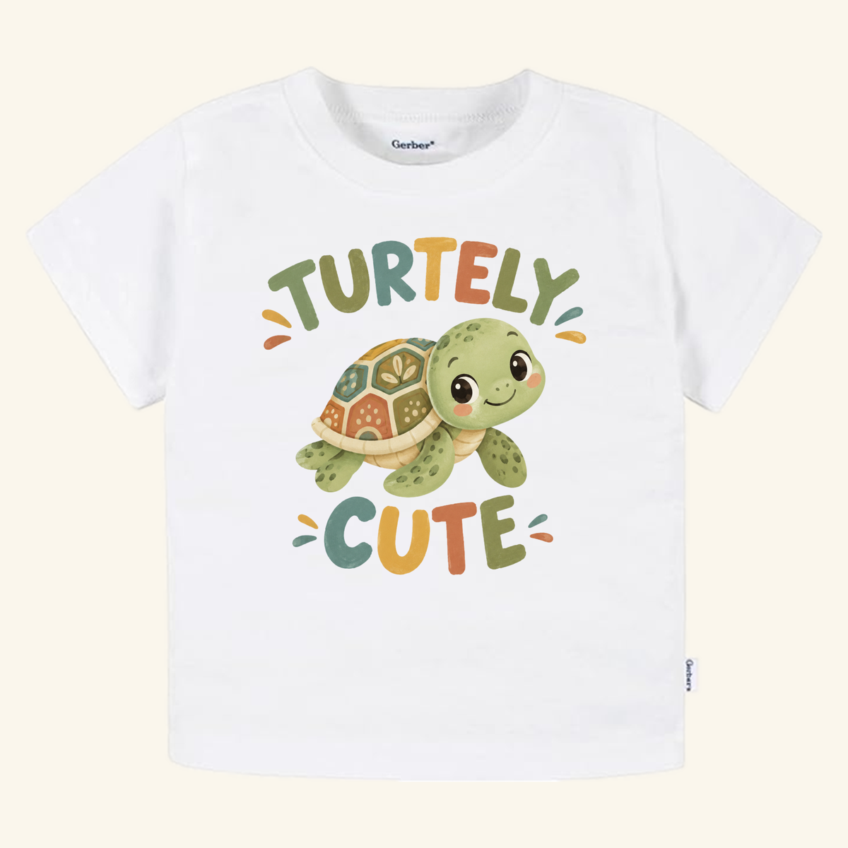 Turtley Cute Toddler Shirt – Watercolor Turtle Short-Sleeve Tee featuring a white short-sleeve design with a watercolor-style illustration of a smiling turtle and the text TURTELY CUTE.
