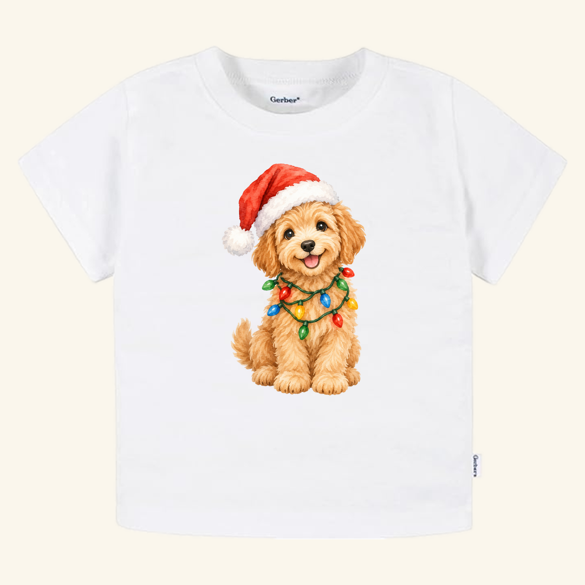 Toodleroos Christmas Puppy Toddler Shirt – Cute Goldendoodle Holiday Tee featuring a white short-sleeved t-shirt with a goldendoodle puppy wearing a Santa hat and wrapped in colorful Christmas lights.