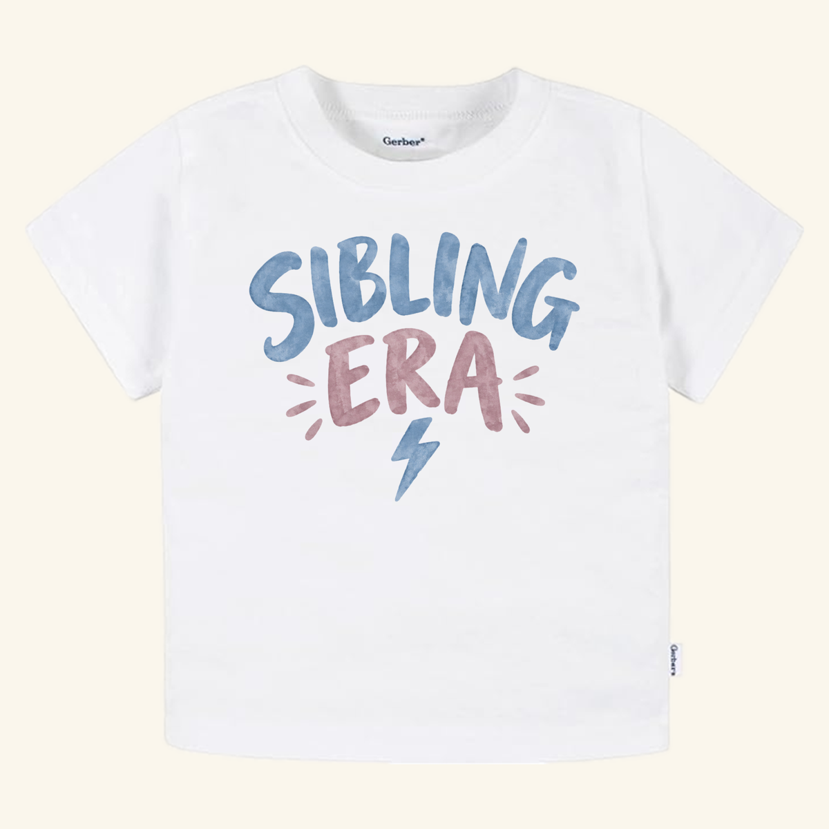 White Toodleroos Sibling Era Toddler Shirt – Lightning Bolt Sibling Tee featuring a blue lightning bolt graphic and blue and pink text, perfect for a gender-neutral style.