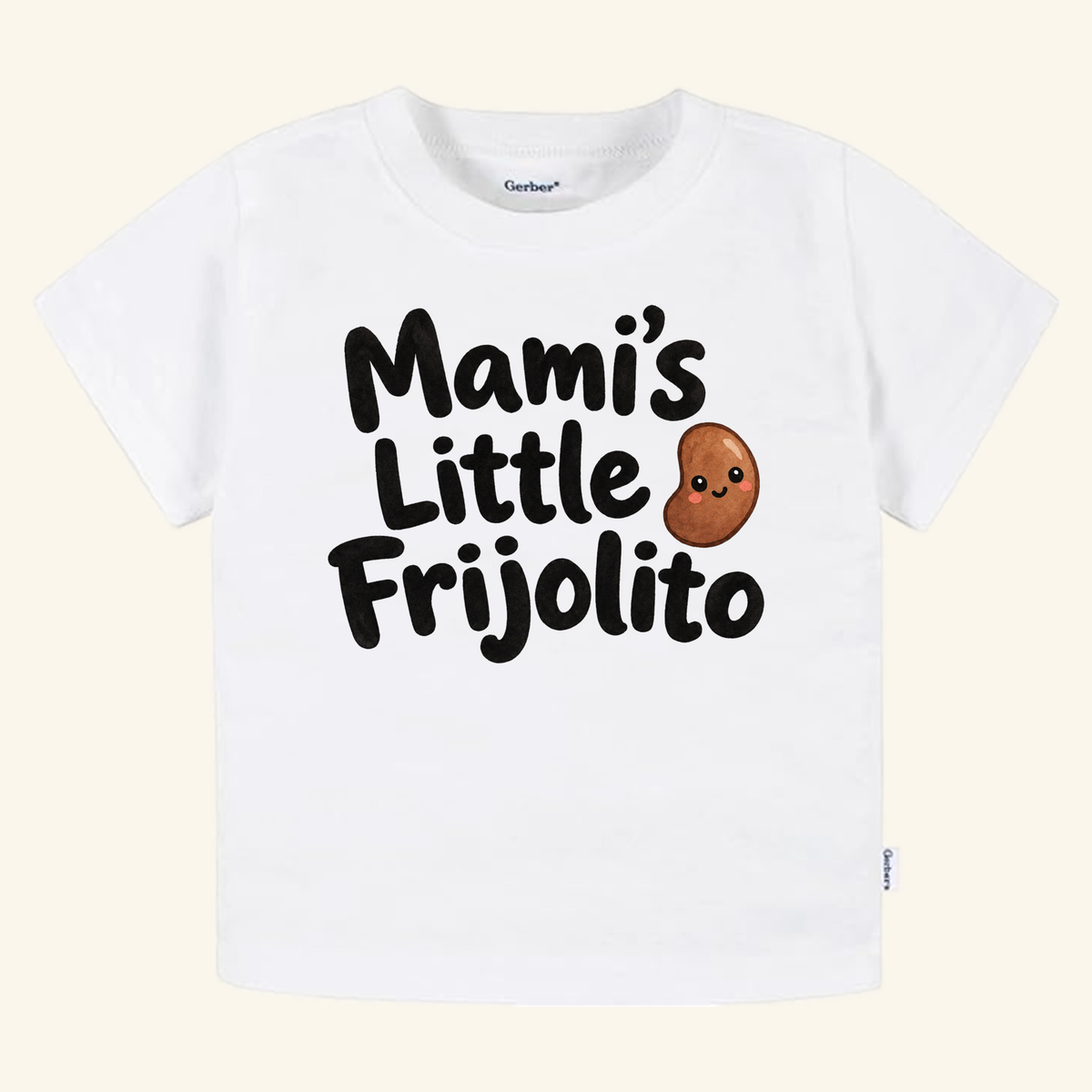 White Mami’s Little Frijolito Toddler Shirt – Cute Spanish Bean Tee featuring a cartoon bean illustration.