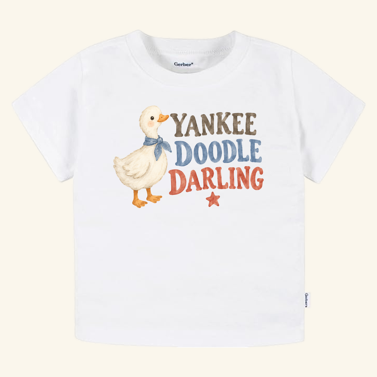 Yankee Doodle Darling Toddler Shirt – Patriotic Duckling Tee featuring a white toddler t-shirt with a watercolor duckling in a blue scarf, the text YANKEE DOODLE DARLING, and a small red star.