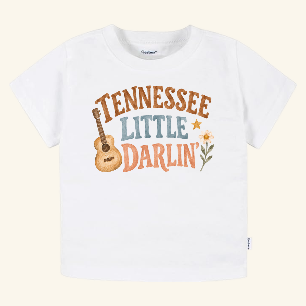 White Tennessee Toddler Shirt – Little Darlin’ Guitar Country Tee featuring the text TENNESSEE LITTLE DARLIN with an illustration of an acoustic guitar, a star, and a flower.