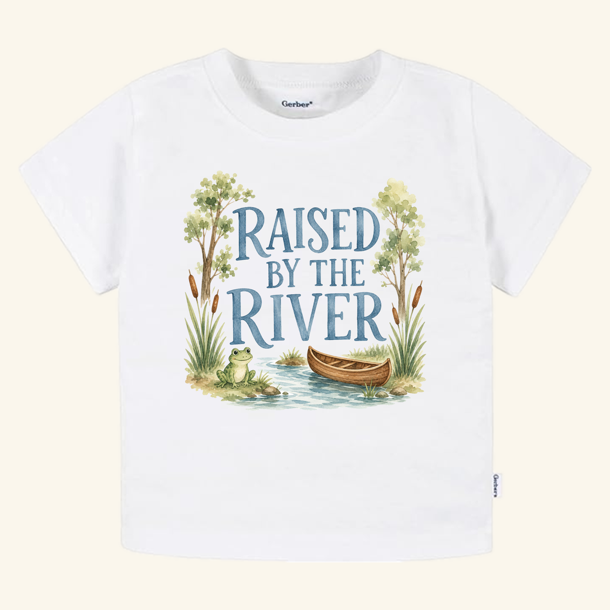 Raised by the River Toddler Shirt featuring a white t-shirt with a watercolor illustration of a frog, a canoe in a river, and the text Raised by the River.