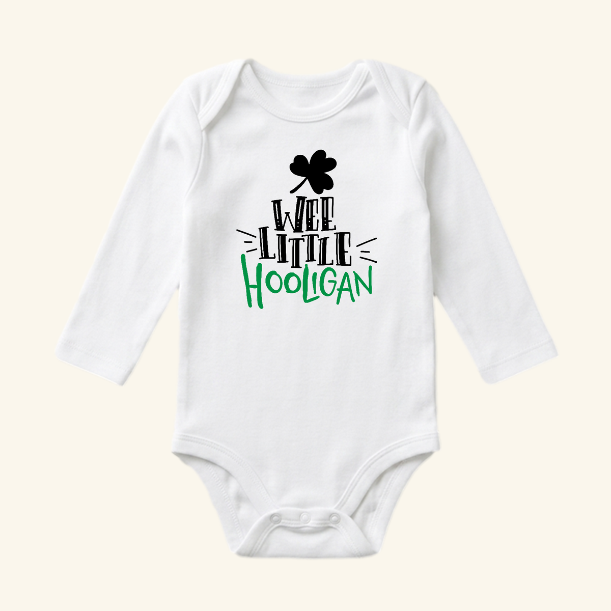 St. Patrick’s Day Baby Onesie – Wee Little Hooligan Bodysuit in white long-sleeve style featuring a black shamrock icon and black and green text.