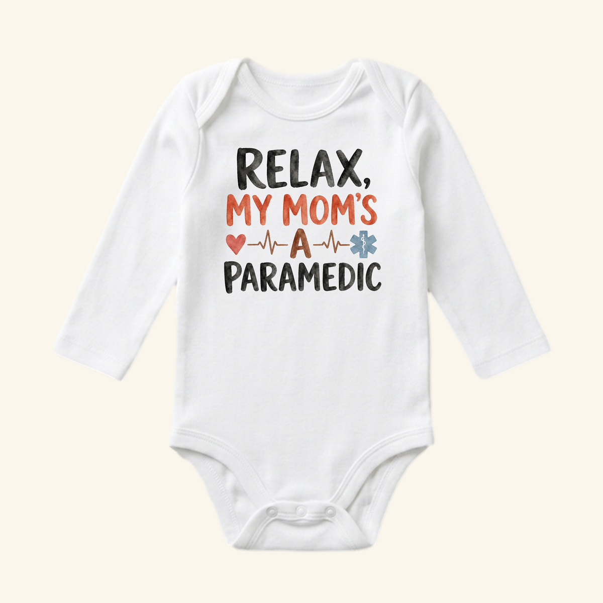 White long-sleeve Paramedic Mom Baby Onesie – Relax My Mom’s a Paramedic Bodysuit with the text RELAX, MY MOMS A PARAMEDIC featuring a heart, an EKG line, and a Star of Life symbol.