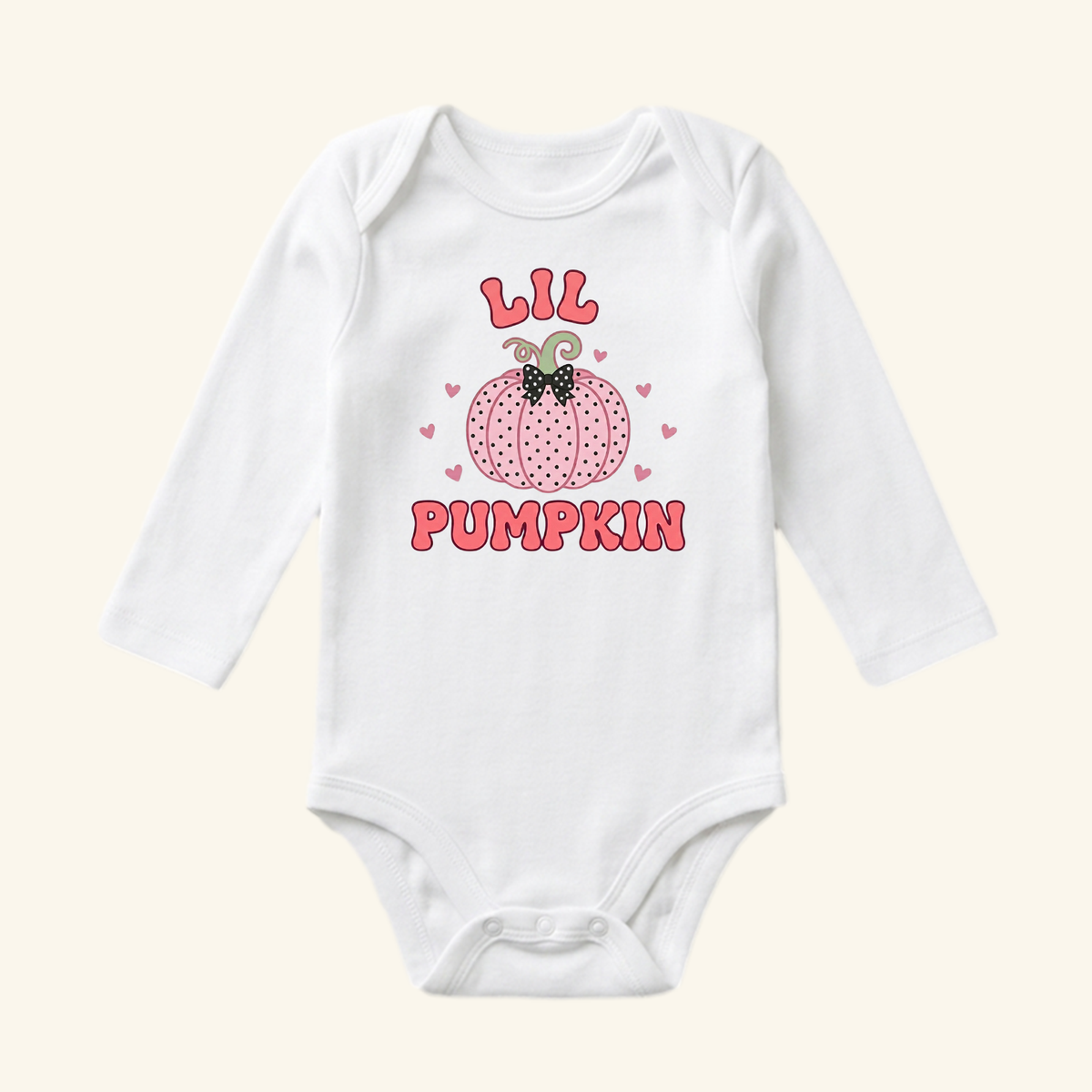 Lil Pumpkin Baby Girl Onesie – Fall Pumpkin Bodysuit featuring a white long-sleeve design with a pink dotted pumpkin graphic, a small black bow, and Lil Pumpkin text surrounded by hearts.
