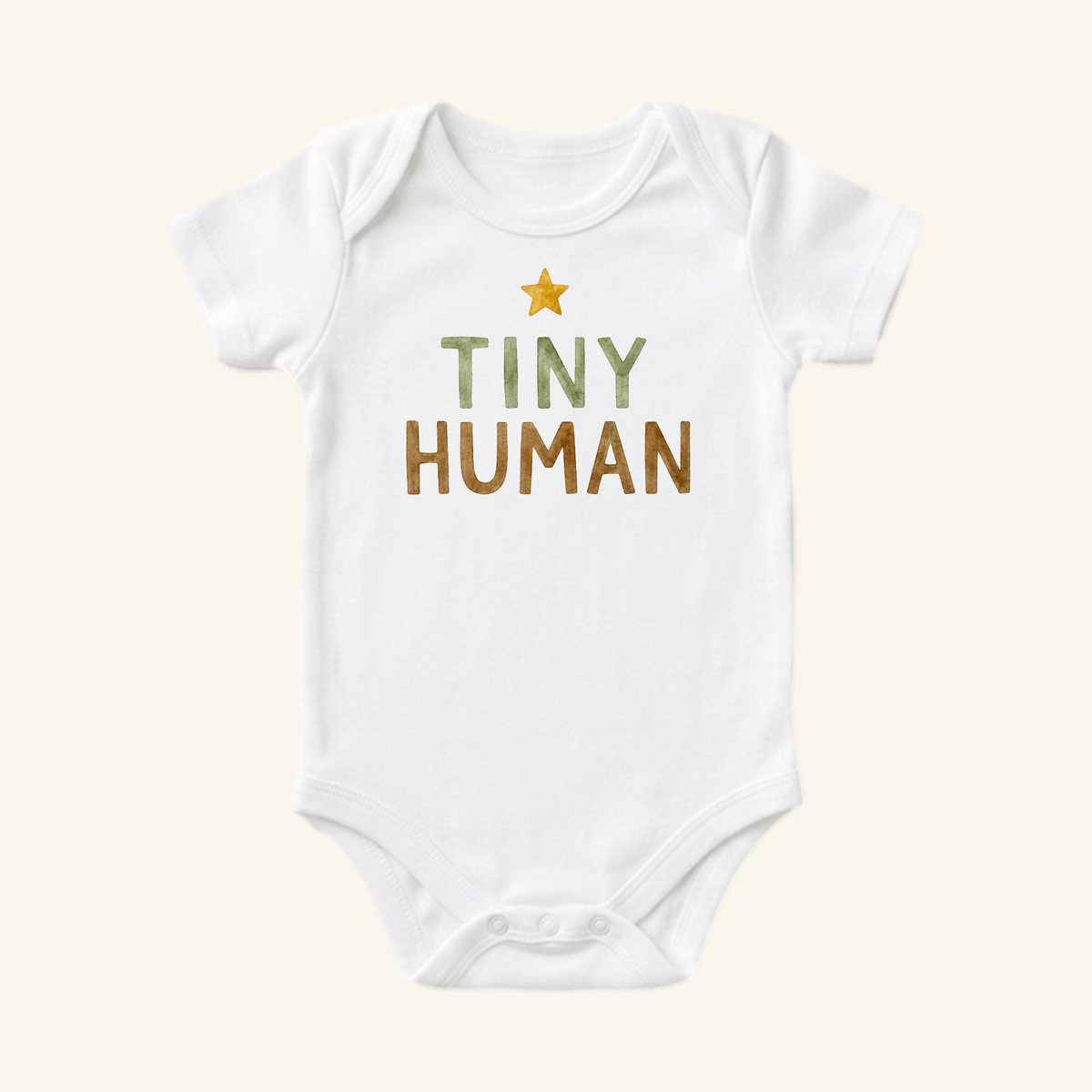 Toodleroos Tiny Human Baby Onesie – Minimalist Star Bodysuit featuring a small yellow star above the text TINY HUMAN in green and brown letters.