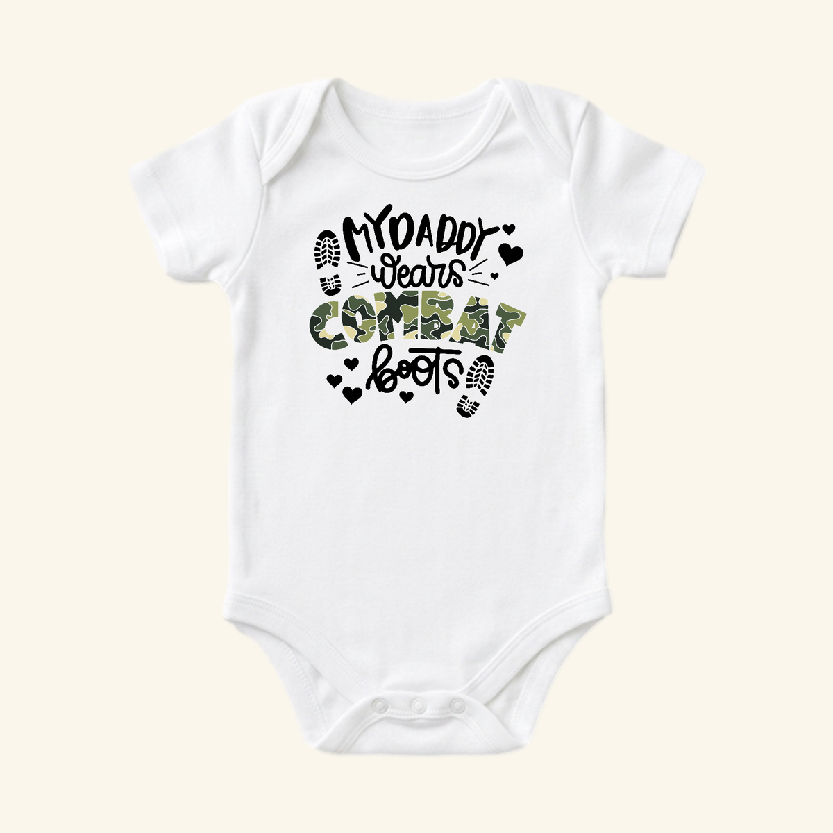 Toodleroos Military Baby Onesie – My Daddy Wears Combat Boots bodysuit, a white onesie featuring black and camouflage text, heart accents, and boot print icons.