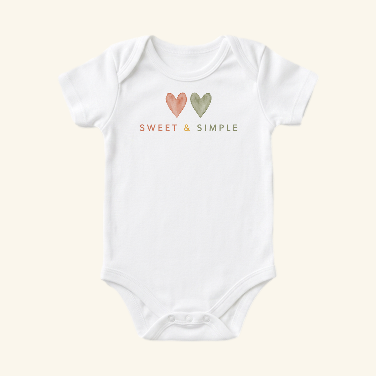 Toodleroos Gender-Neutral Baby Onesie – Sweet & Simple Heart Bodysuit featuring two small watercolor hearts and the text SWEET & SIMPLE printed in the center of a white short-sleeve minimalist bodysuit.