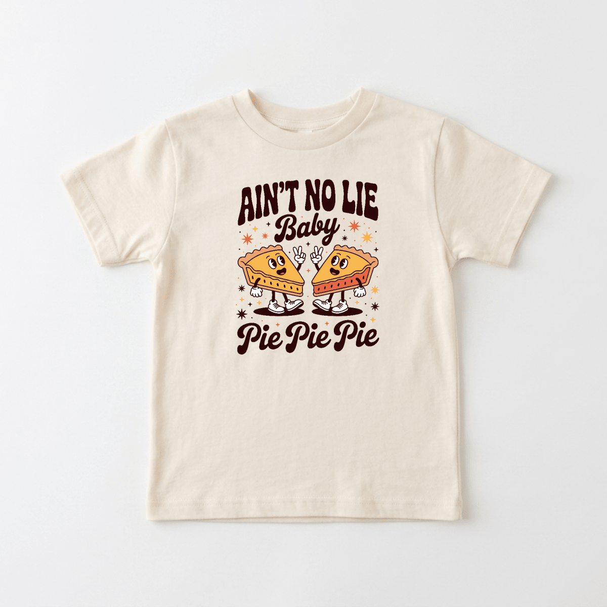 Dress your little one in the Toodleroos “Funny Toddler Thanksgiving Shirt – Ain’t No Lie Baby Pie Pie Pie Tee,” a cream-colored tee featuring two cartoon pie slices and the playful phrase “Ain’t No Lie Baby Pie Pie Pie”—the perfect cute and funny Thanksgiving outfit for kids!.