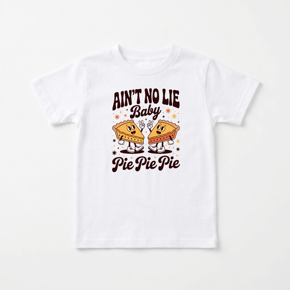 The Toodleroos Funny Toddler Thanksgiving Shirt – Ain’t No Lie Baby Pie Pie Pie Tee is a white shirt featuring smiling cartoon pie slices, stars, and bold brown and orange “AIN’T NO LIE BABY PIE PIE PIE” lettering—making it a cute and funny Thanksgiving outfit that’s perfect as a playful pie graphic tee for toddlers.