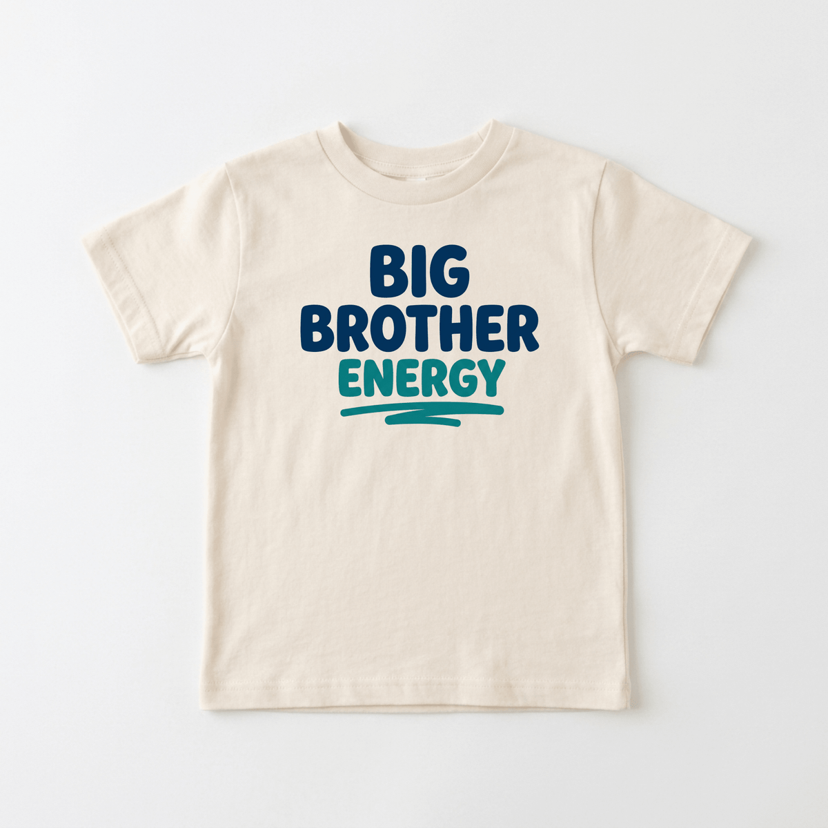 Dress your little one in the Toodleroos Big Brother Energy Toddler Shirt – Confident Sibling Tee, featuring bold blue and green BIG BROTHER ENERGY text on a beige toddler tee—perfect for celebrating his new role as big brother.