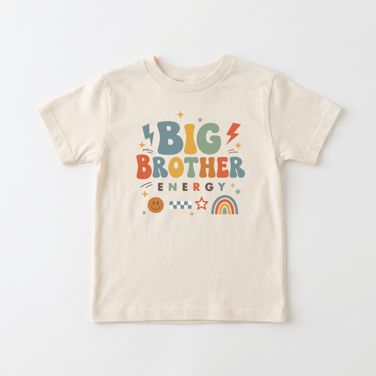 Dress your toddler in the Toodleroos Big Brother Energy Toddler Shirt – Retro Graphic Design, featuring a beige base with colorful lettering that says “Big Brother Energy” and fun graphics like lightning bolts, stars, a rainbow, checkerboard pattern, and a smiley face—ideal for celebrating your little one as a big brother or making an adorable pregnancy announcement.