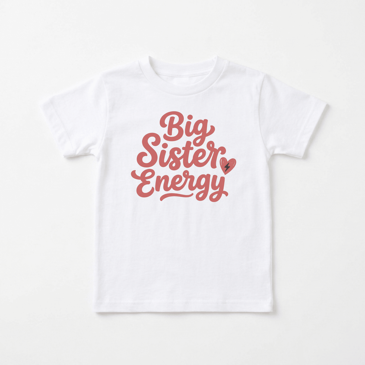 The Toodleroos Big Sister Energy Toddler Shirt – Confident Sibling Tee is a white toddler tee with pink cursive text that says “Big Sister Energy” and a small pink heart graphic on the front, perfect for celebrating any little one promoted to big sister.