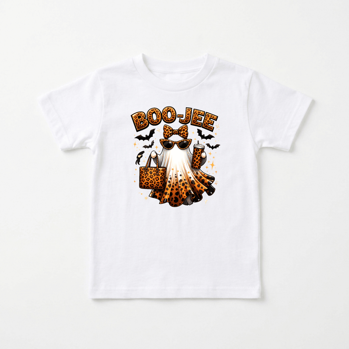 Let your little one shine this spooky season with the Toodleroos Boo-Jee Ghost Toddler Girls Shirt – Leopard Print Halloween Tee. This trendy white shirt features an adorable ghost sporting sunglasses, a bow, and carrying a leopard print purse, with “BOO-JEE” playfully written above. Surrounded by bats, sparkles, and a tiny spider, it’s the perfect Halloween tee to add stylish fun to your toddler’s wardrobe!.