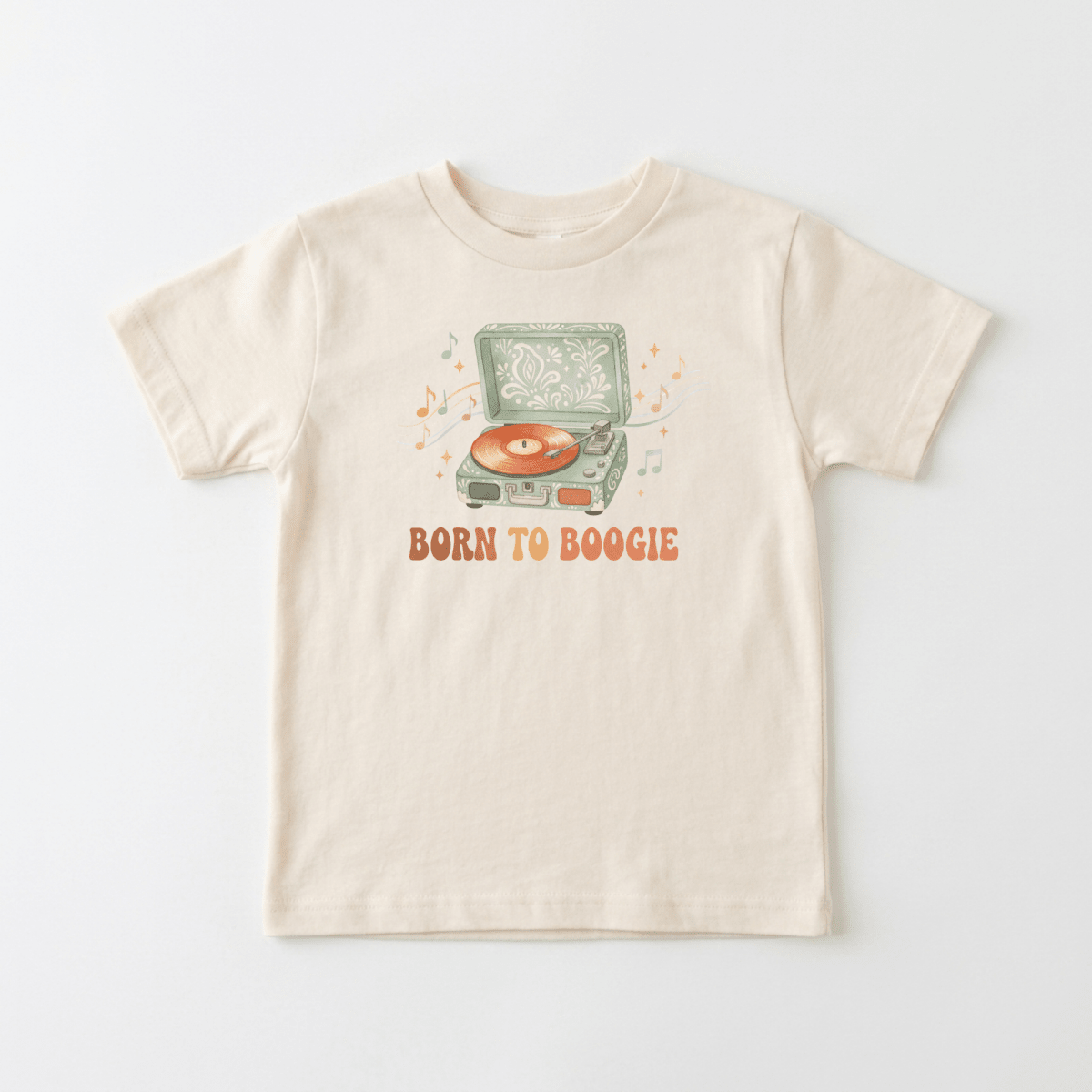 Dress your little one in the Toodleroos Toddler Short-Sleeve Music Shirt – Born to Boogie Retro Record Player Tee, featuring a beige design with a vintage record player spinning vinyl, surrounded by playful music notes. The bold orange “BORN TO BOOGIE” text beneath the illustration makes this retro tee perfect for young music lovers who want to show off their groove!.