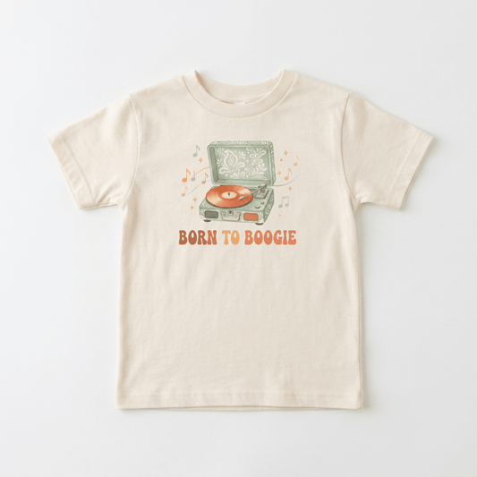 Dress your little one in the Toodleroos Toddler Short-Sleeve Music Shirt – Born to Boogie Retro Record Player Tee, featuring a beige design with a vintage record player spinning vinyl, surrounded by playful music notes. The bold orange “BORN TO BOOGIE” text beneath the illustration makes this retro tee perfect for young music lovers who want to show off their groove!.