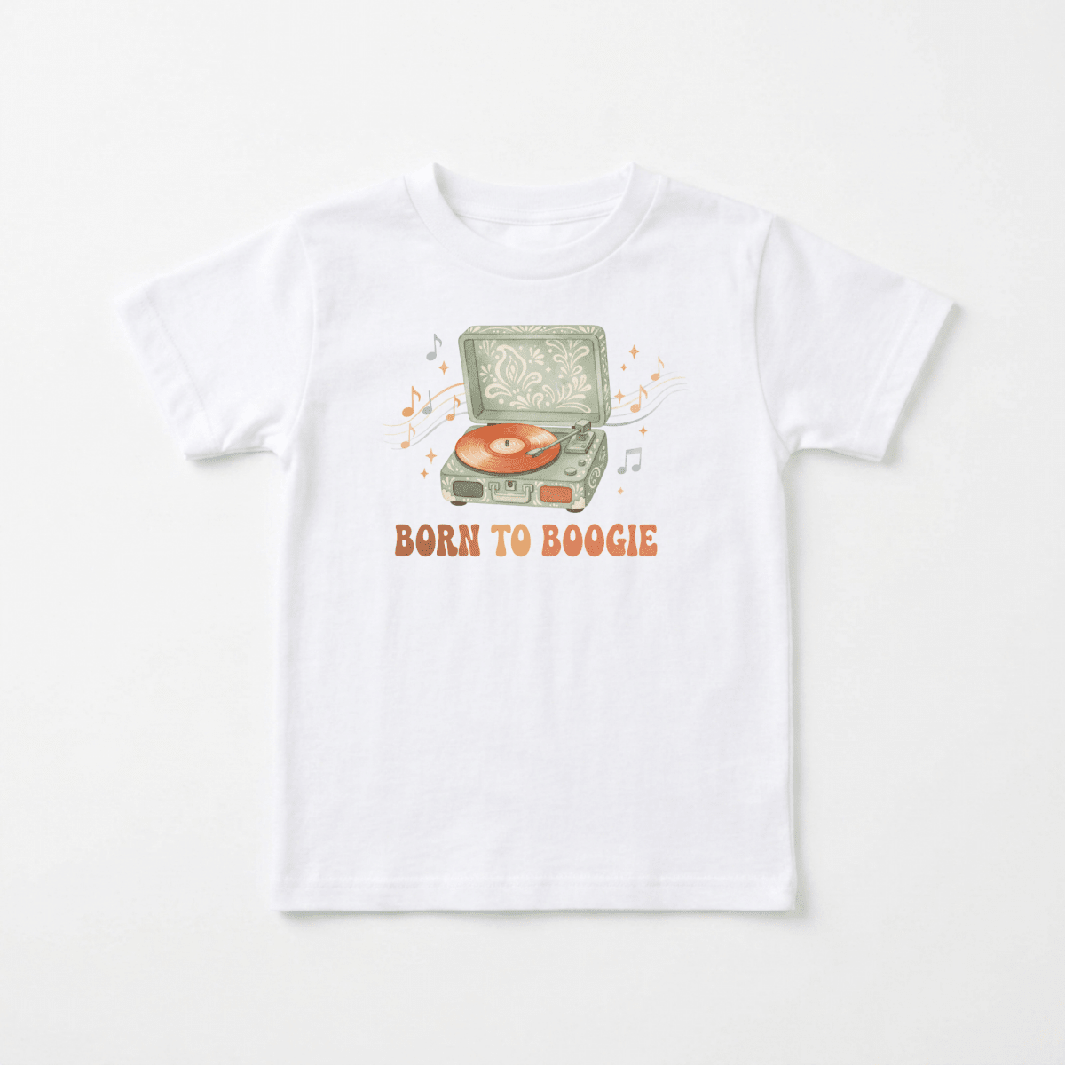 Introducing the Toddler Short-Sleeve Music Shirt – Born to Boogie Retro Record Player Tee by Toodleroos! This white tee features a playful illustration of a vintage record player spinning an orange vinyl, with musical notes surrounding it and “BORN TO BOOGIE” boldly printed in orange below. Perfect for little music lovers, this fun toddler shirt from Toodleroos adds retro flair to any child’s wardrobe.