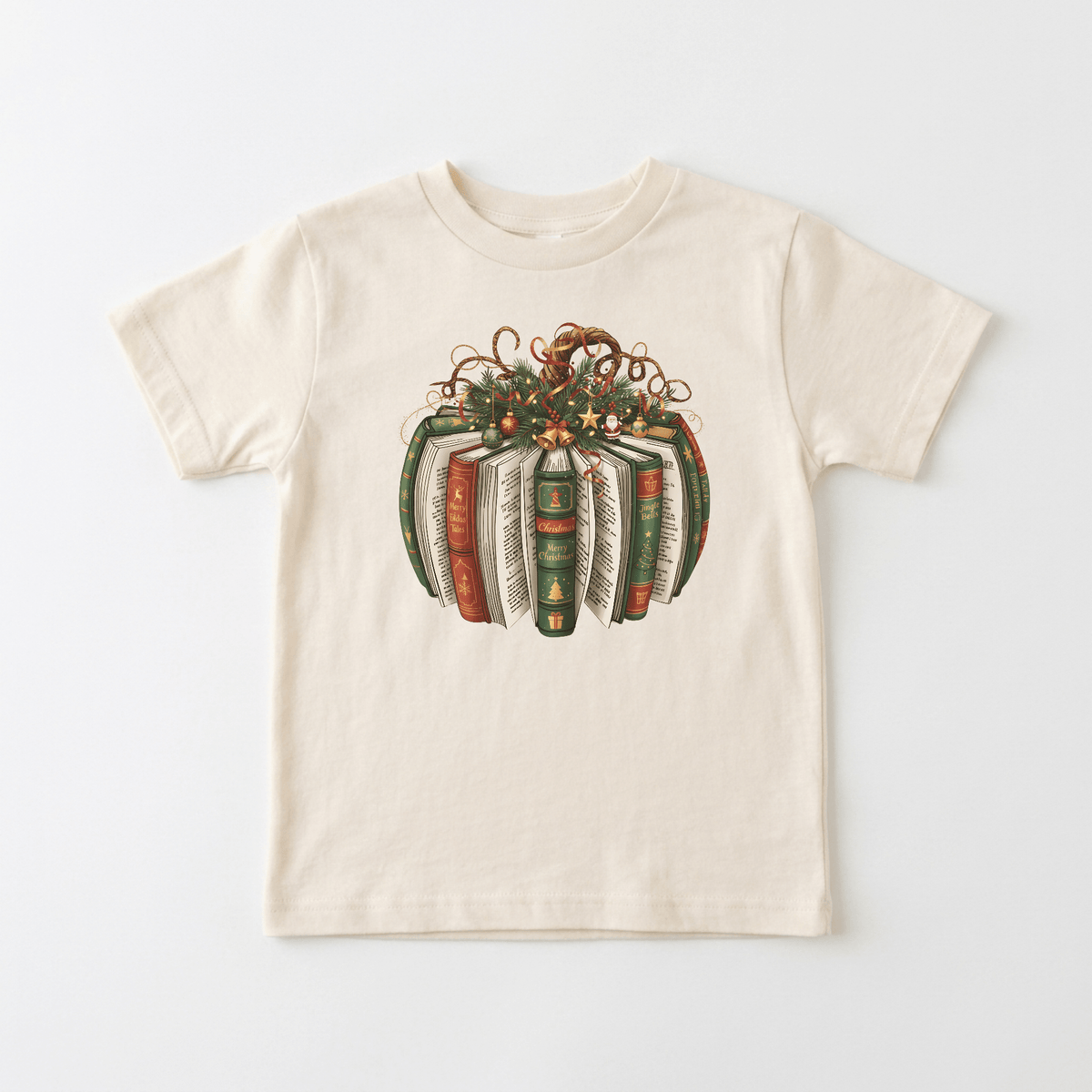 Introducing the Christmas Book Wreath Tee – Baby Holiday Shirt from Toodleroos: a beige T-shirt adorned with an illustration of books arranged in a circle, accented by greenery, ribbons, and red berries for a festive holiday book wreath design—perfect as a literary-themed holiday shirt for any book-loving family ensemble.
