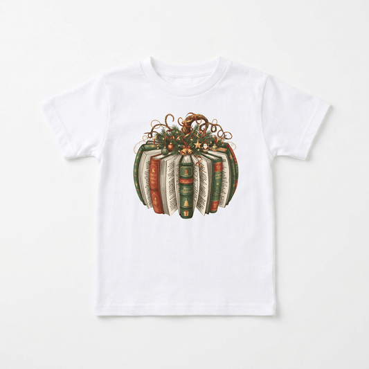 Dress your little one in festive style with the Toodleroos Christmas Book Wreath Tee – a white baby holiday shirt featuring an illustrated wreath made from stacked vintage books with green, brown, and red covers, adorned with autumn leaves and curly vines—the perfect literary-themed addition to any book-loving family’s holiday outfit.