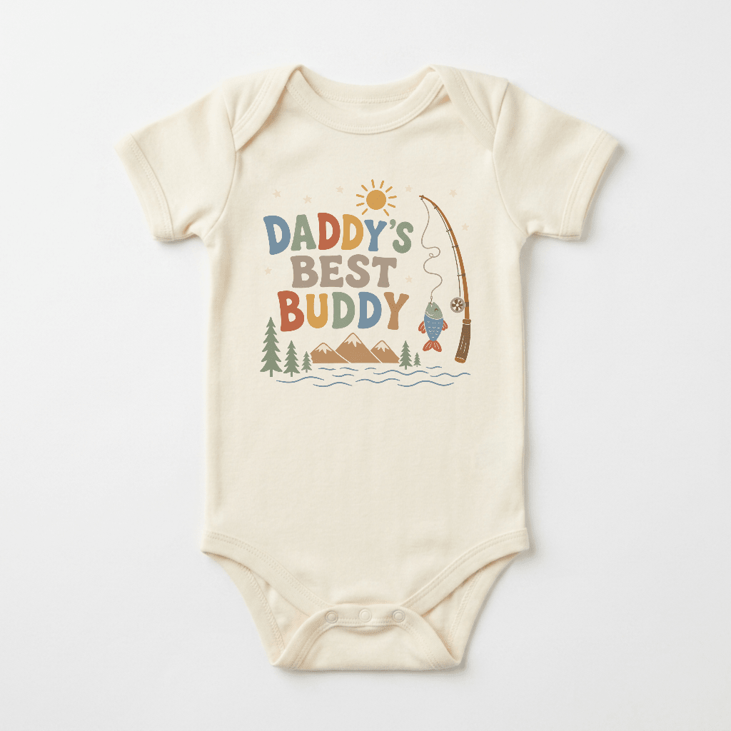 Dress your little one in adventure-ready style with the Toodleroos Baby Boy Fishing Onesie – Daddy’s Best Buddy Short-Sleeve Bodysuit. This cozy cream-colored bodysuit features playful “Daddy’s Best Buddy” text on the front, along with charming illustrations of a sun, mountains, pine trees, water, and a fishing pole catching a fish—perfect for babies who love exploring with dad!.