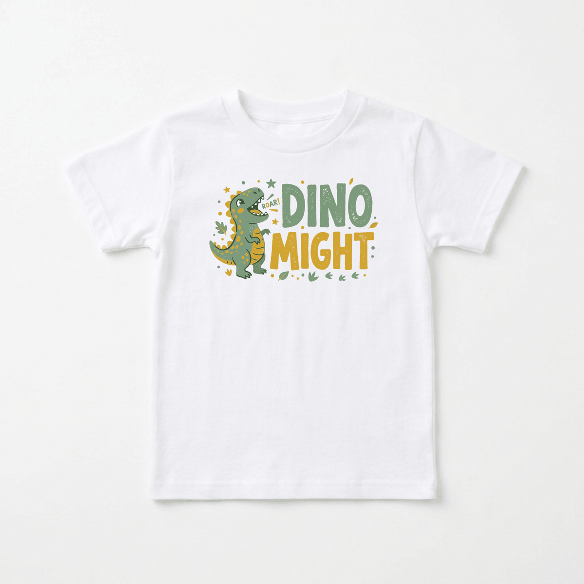 Introduce your little one to prehistoric fun with the Dino Might Toddler Shirt – Roaring Dinosaur Tee by Toodleroos! Featuring a white t-shirt adorned with a cartoon green dinosaur roaring and surrounded by cheerful yellow stars, this top also displays the playful text “Roar! DINO MIGHT” in bold green and yellow lettering. It’s the perfect dinosaur birthday gift or a fun dino-themed toddler tee for kids who love dinosaurs!.