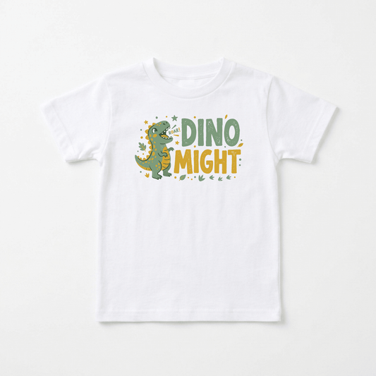 Introduce your little one to prehistoric fun with the Dino Might Toddler Shirt – Roaring Dinosaur Tee by Toodleroos! Featuring a white t-shirt adorned with a cartoon green dinosaur roaring and surrounded by cheerful yellow stars, this top also displays the playful text “Roar! DINO MIGHT” in bold green and yellow lettering. It’s the perfect dinosaur birthday gift or a fun dino-themed toddler tee for kids who love dinosaurs!.