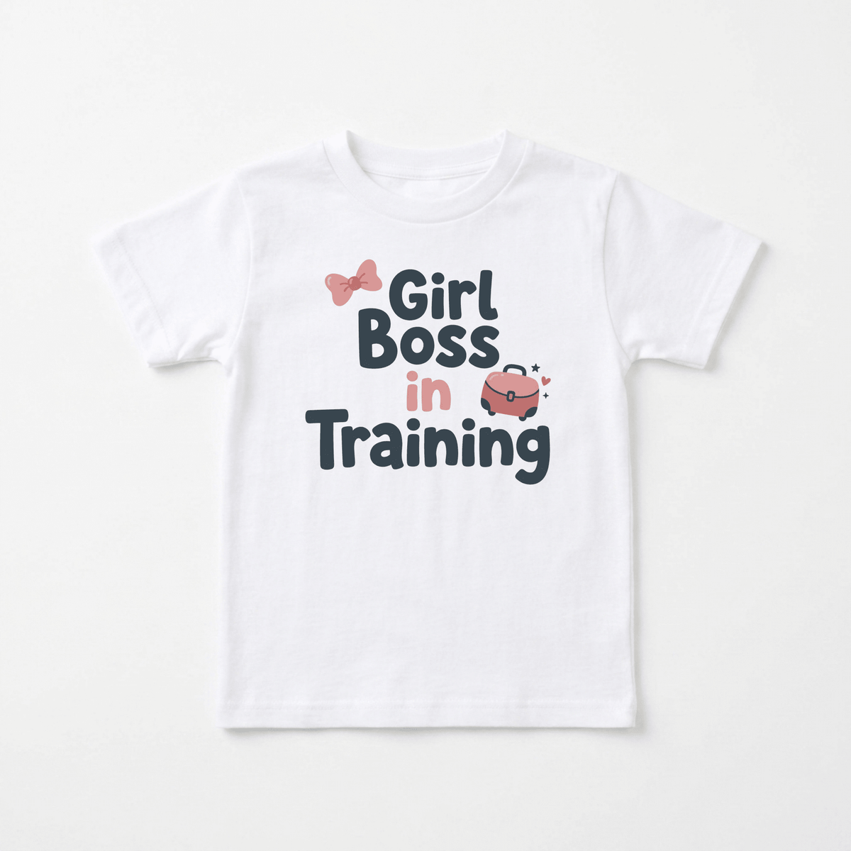 Dress your little leader in style with the Toodleroos “Girl Boss in Training Toddler Girls Shirt – Confident Bow Tee.” This adorable white toddler tee features playful pink and black text reading “Girl Boss in Training,” a cute pink bow above “Girl,” and a sparkling pink purse graphic nearby. Perfect for future bosses, this must-have toddler graphic shirt combines fun design with empowering flair—an ideal choice for confident girls who love stylish tees!.