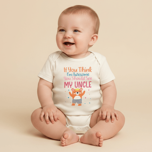 A smiling baby sits on a beige floor wearing the Toodleroos “If You Think I’m Awesome See My Uncle” Baby Onesie – a funny bear bodysuit that makes a charming baby shower gift.