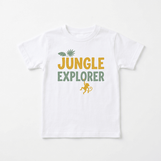 The Toodleroos Jungle Explorer Toddler Shirt – Monkey Safari Tee features “JUNGLE EXPLORER” printed in bold yellow and green letters, accented with a leaf and palm above and a playful monkey silhouette hanging below—making it the perfect safari-themed gift for little nature lovers.