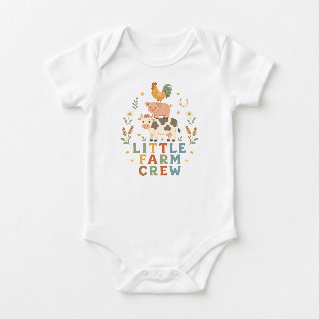Dress your little one for country adventures in the Toodleroos Little Farm Crew Farm Animal Baby Onesie, a white onesie featuring adorable illustrations of a rooster, pig, and cow stacked above the phrase “LITTLE FARM CREW,” surrounded by whimsical leaves and stars. This charming onesie is the perfect addition to any boho baby clothes collection.