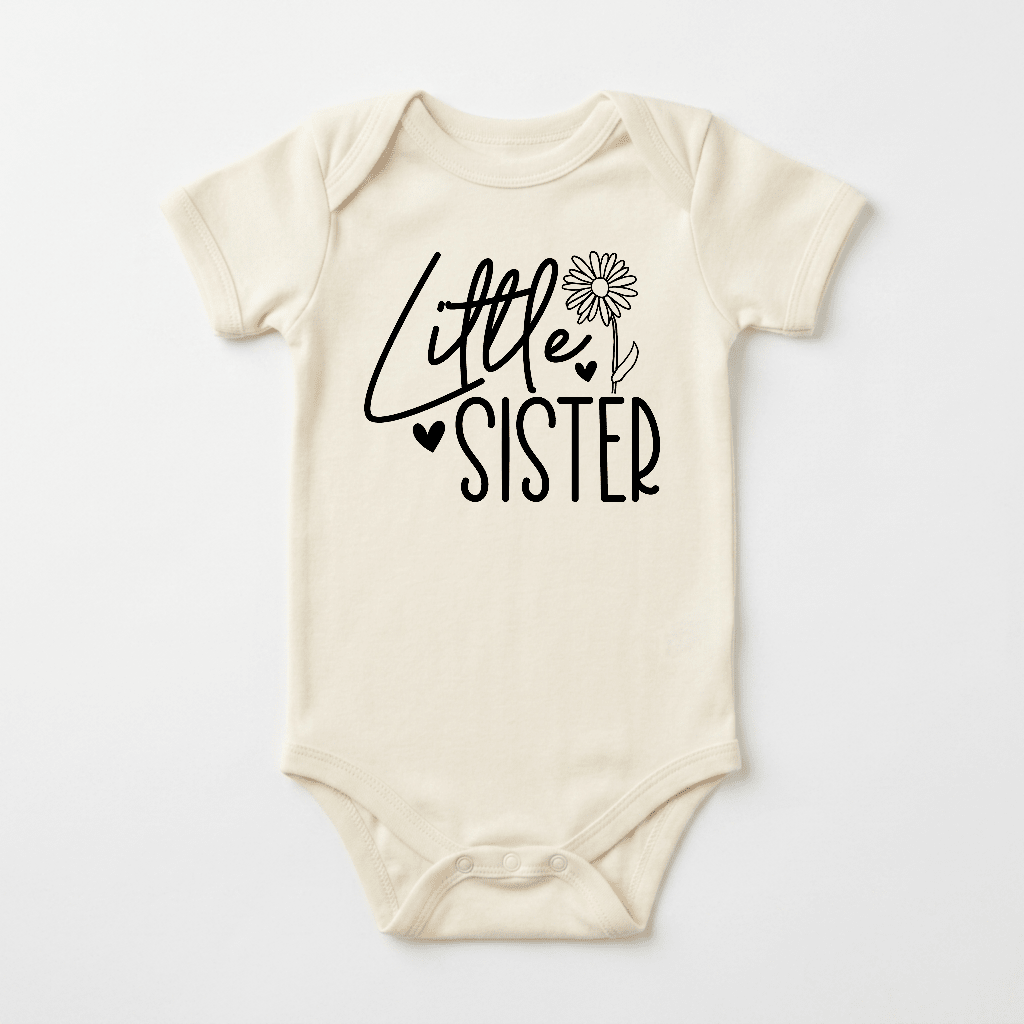 A cream-colored Toodleroos Little Sister Onesie – Baby Girl Announcement Bodysuit with “Little Sister” printed in black, featuring a daisy flower and a small heart in the design—perfect for a sibling reveal or as a sweet pregnancy announcement shirt.