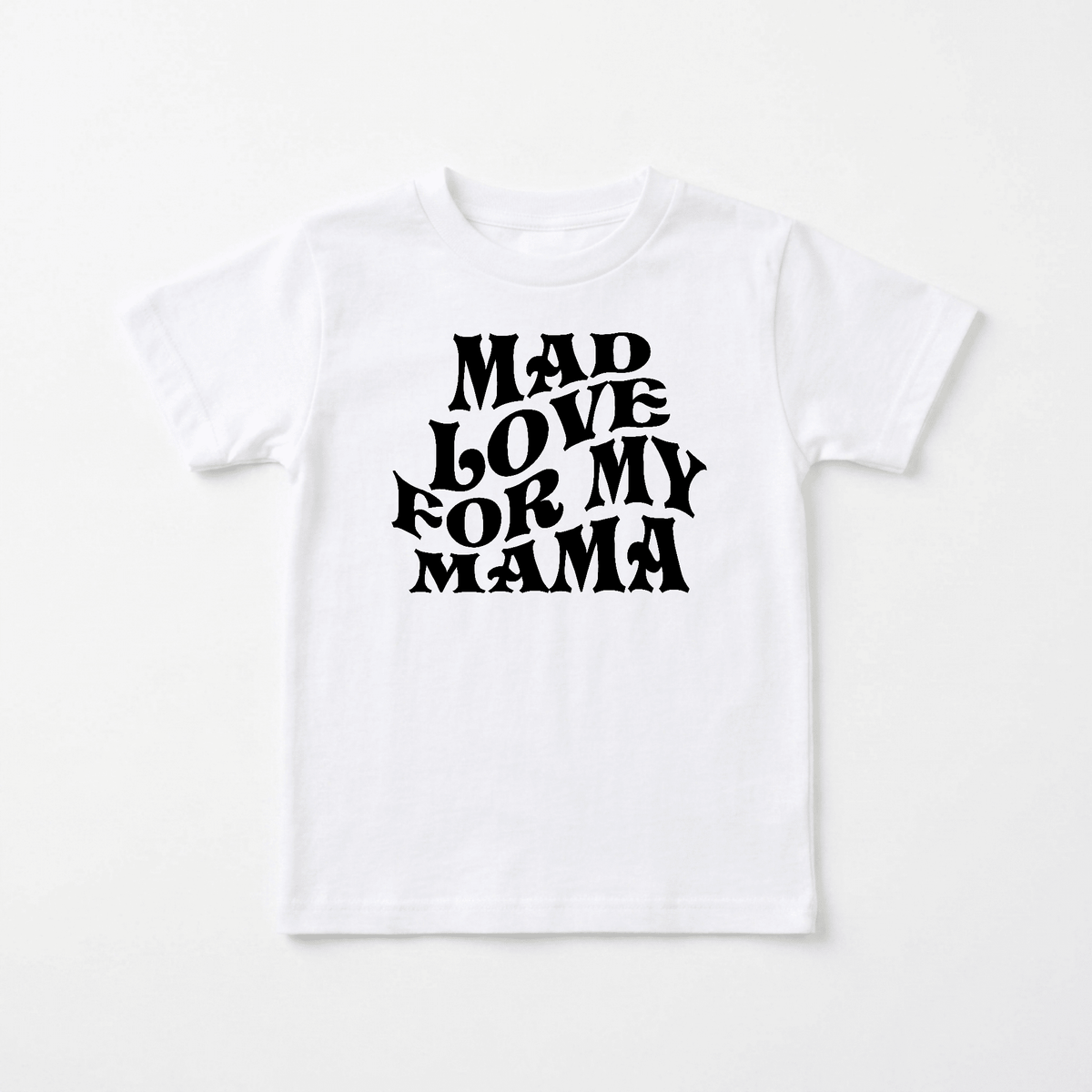 Introducing the Mad Love for My Mama Toddler Shirt – Mother’s Day Tee by Toodleroos. This retro toddler t-shirt features bold, black, wavy text on the front that reads “MAD LOVE FOR MY MAMA,” and is displayed laid flat on a plain white background—perfect for celebrating Mother’s Day!.