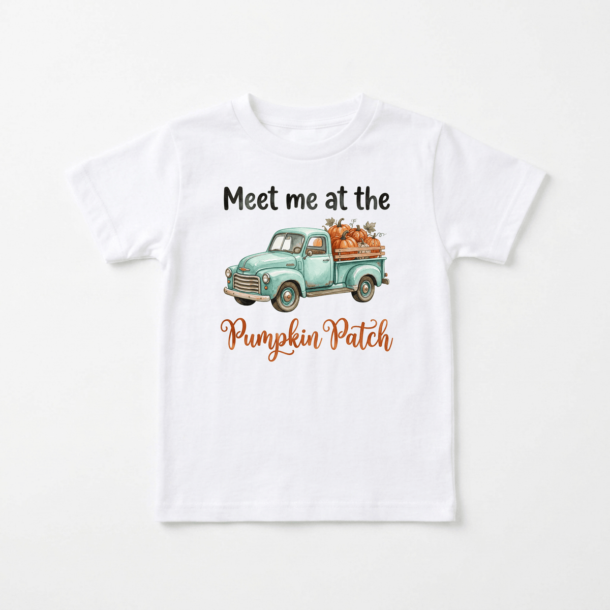 The Meet Me at the Pumpkin Patch Kids Shirt – Fall Truck Tee by Toodleroos features a cozy white t-shirt with a watercolor illustration of a vintage truck carrying pumpkins. Above the truck, the shirt reads “Meet me at the,” and below, “Pumpkin Patch” is written in orange cursive. This adorable fall tee is perfect for autumn adventures or trips to the pumpkin patch.