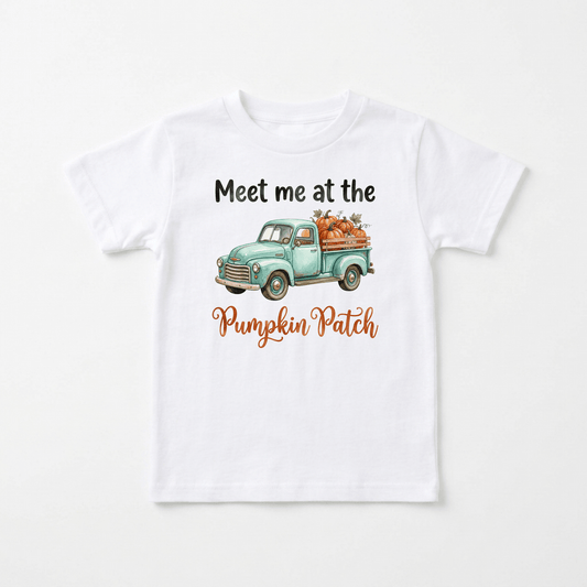 The Meet Me at the Pumpkin Patch Kids Shirt – Fall Truck Tee by Toodleroos features a cozy white t-shirt with a watercolor illustration of a vintage truck carrying pumpkins. Above the truck, the shirt reads “Meet me at the,” and below, “Pumpkin Patch” is written in orange cursive. This adorable fall tee is perfect for autumn adventures or trips to the pumpkin patch.