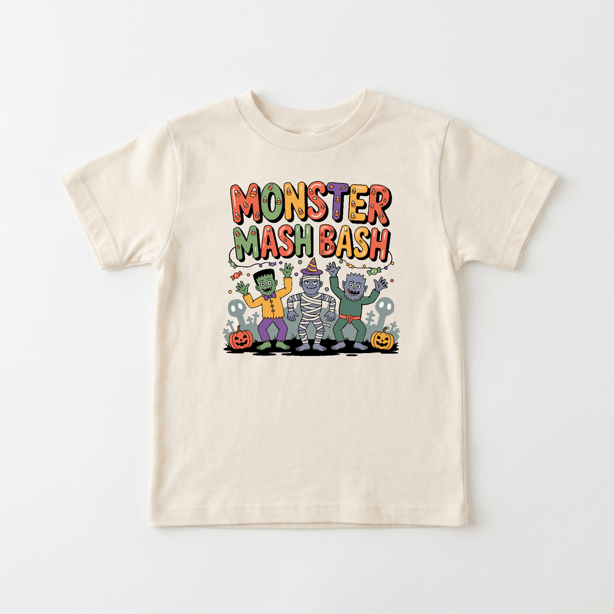 The Toodleroos Monster Mash Bash Halloween Toddler Shirt features friendly cartoon monsters, pumpkins, and colorful “Monster Mash Bash” text on a beige tee—perfect as a fun kids’ Halloween party shirt or toddler-friendly monster tee.