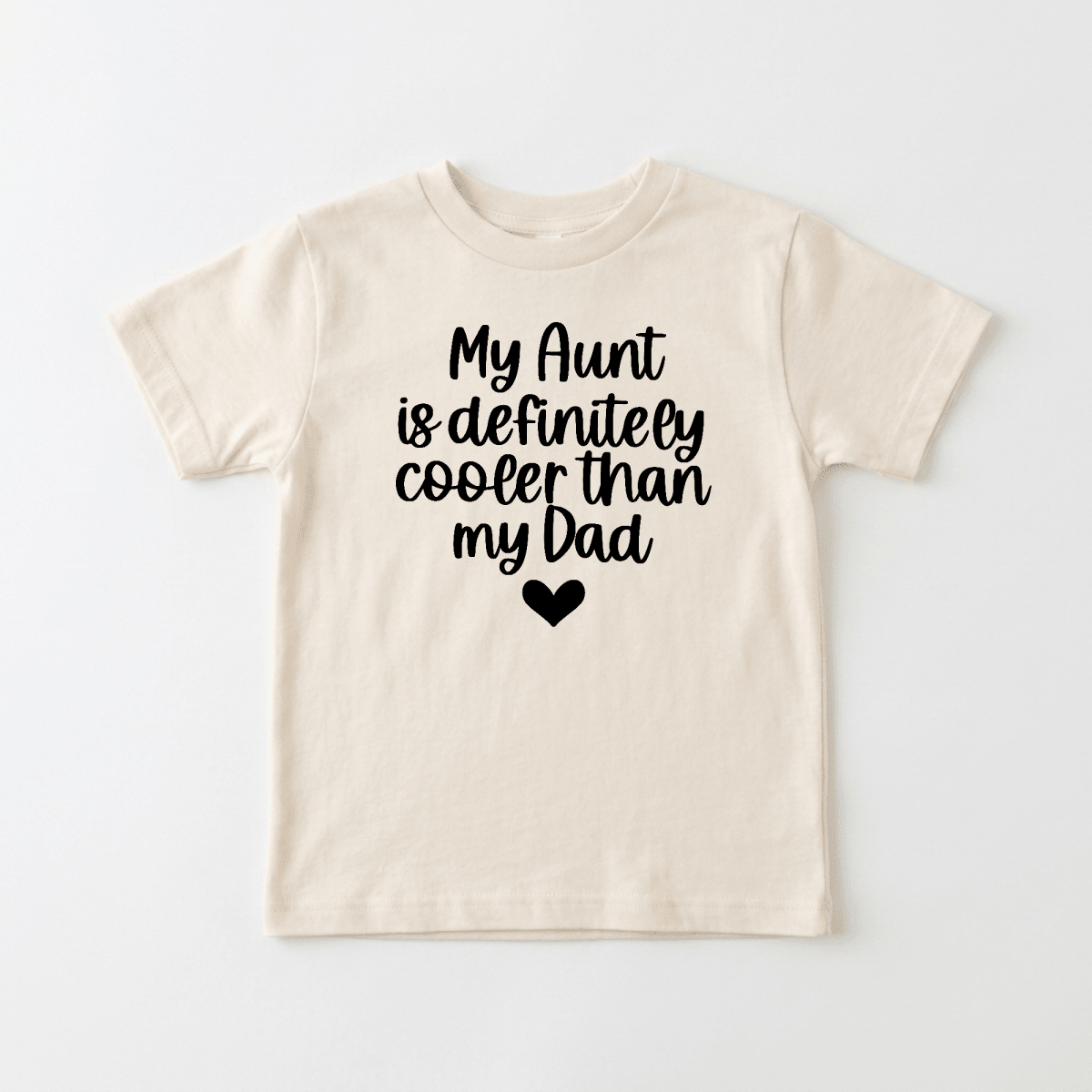 Dress your little one in the Toodleroos My Aunt Is Definitely Cooler Than My Dad Toddler Shirt – a beige children’s tee featuring playful black text with a small heart. This funny family tee is the perfect aunt gift or a charming toddler shirt for kids who love their awesome aunties.