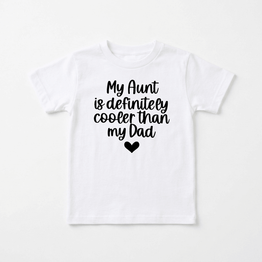 Introducing the My Aunt Is Definitely Cooler Than My Dad Toddler Shirt by Toodleroos—a white t-shirt with bold black text reading “My Aunt is definitely cooler than my Dad” and a cute black heart underneath. This funny family tee makes the perfect gift for a cool aunt or an adorable way for your little one to show off their favorite family member!.
