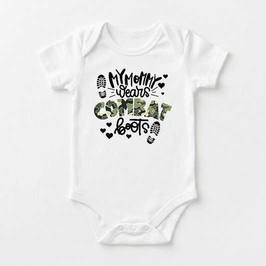 Dress your little one in the Toodleroos My Mommy Wears Combat Boots Baby Onesie – Camo Design, featuring bold black lettering with a green camo pattern on the phrase “My Mommy Wears Combat Boots.” Accented with black hearts and boot prints, this charming military baby bodysuit is the perfect gift for kids celebrating their heroic military moms.
