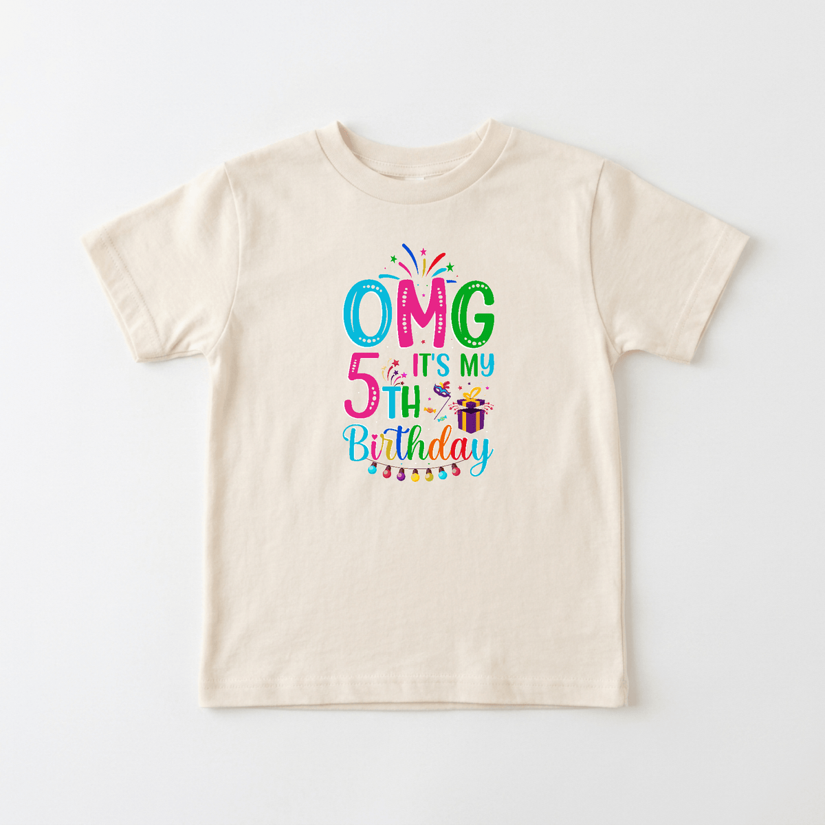 Celebrate your child’s special day with the Toodleroos “OMG It’s My 5th Birthday Kids Shirt – Party Tee,” a beige birthday shirt for boys and girls featuring colorful text, confetti, stars, cake, presents, and party lights—perfect for their big celebration!.