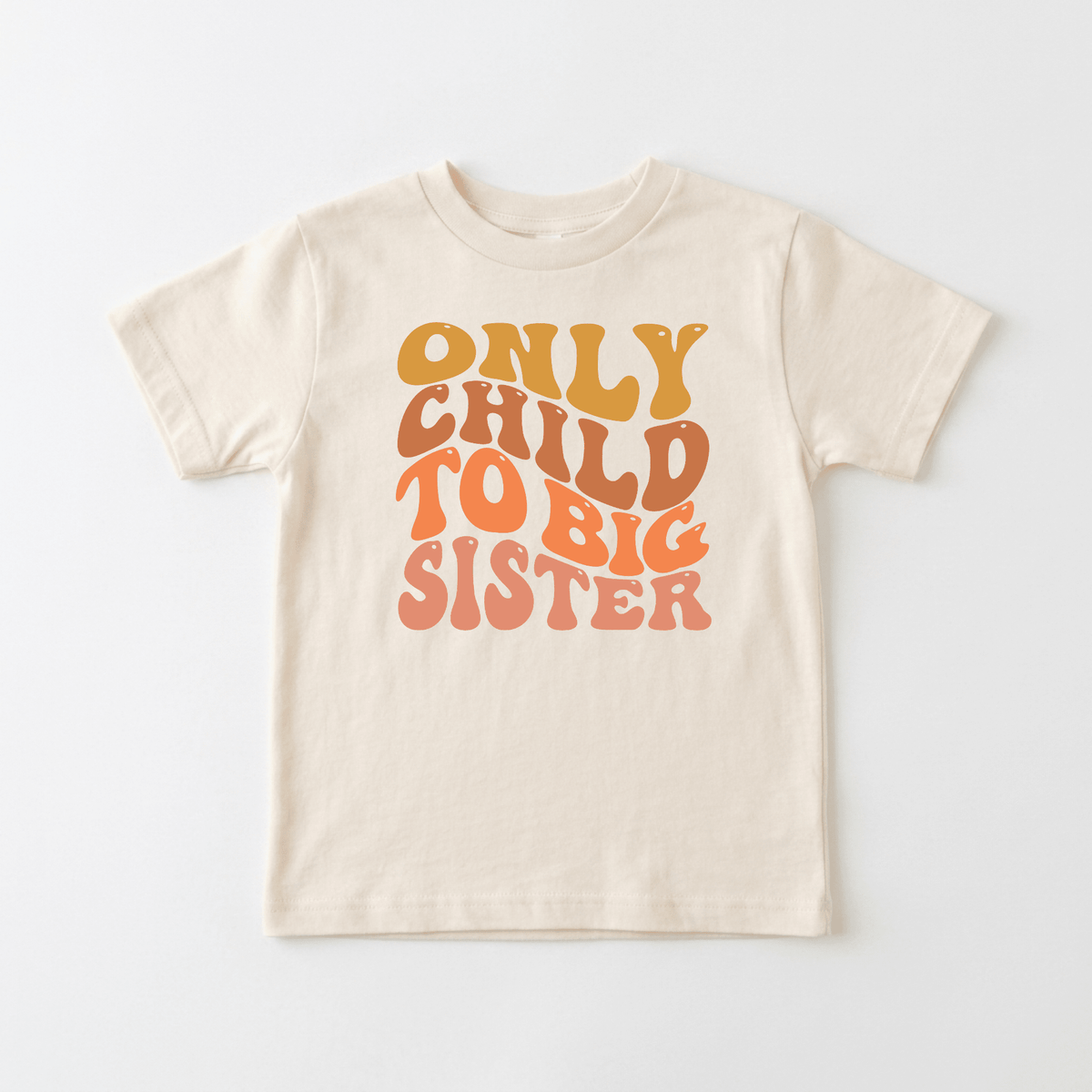 Dress your little one in the Toodleroos Only Child to Big Sister Toddler Shirt – a beige children’s tee featuring bold retro “Only Child to Big Sister” text in cheerful yellow and orange shades on the front. This sibling announcement tee makes a perfect big sister pregnancy reveal or sweet only child to big sister toddler shirt.